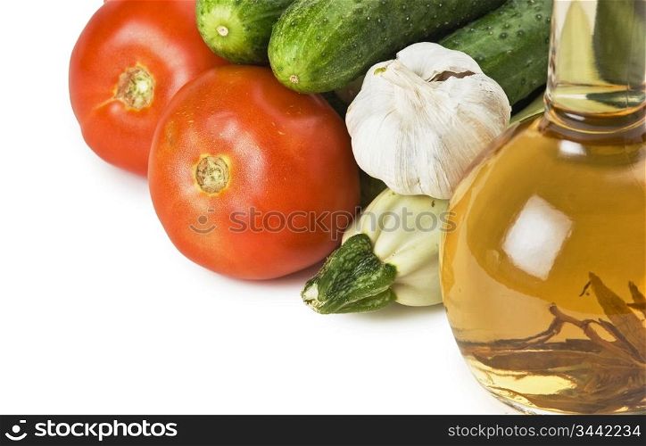 vegetables and a bottle of oil, still life isolated on white background