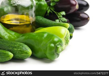 vegetables and a bottle of oil, still life isolated on white background