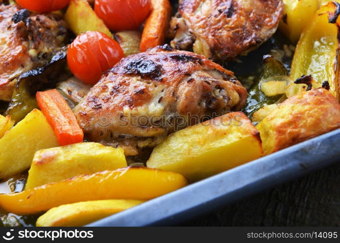 vegetables and chicken in pan baked in oven