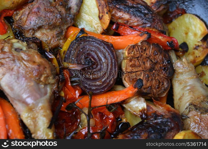 vegetables and chicken in pan baked in oven