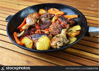 vegetables and chicken in pan baked in oven