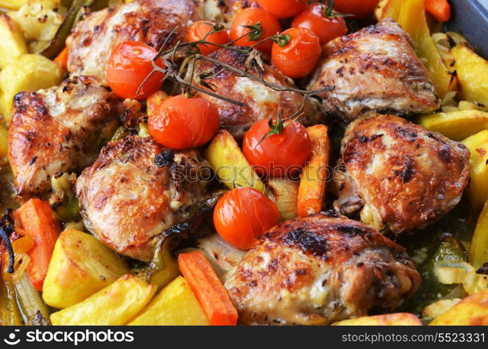 vegetables and chicken in pan baked in oven