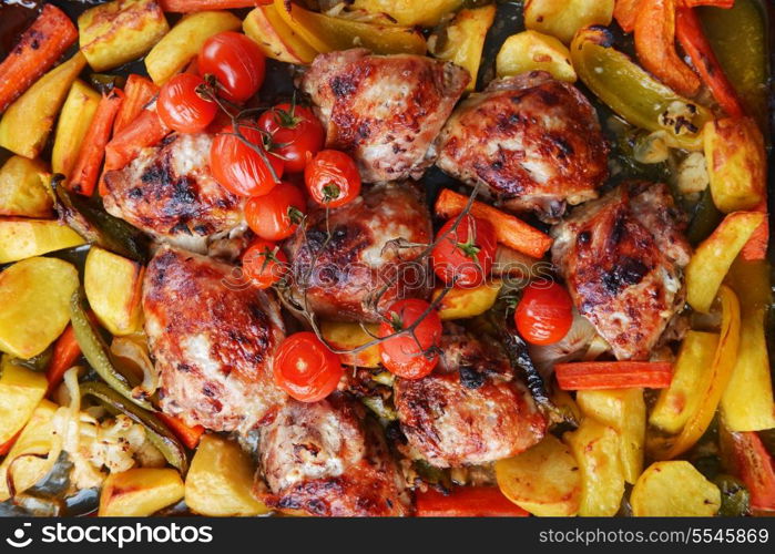 vegetables and chicken in pan baked in oven