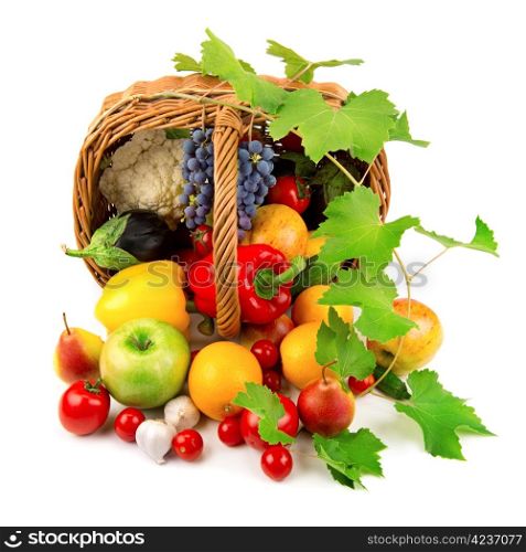 vegetables and fruits in a basket isolated on white background