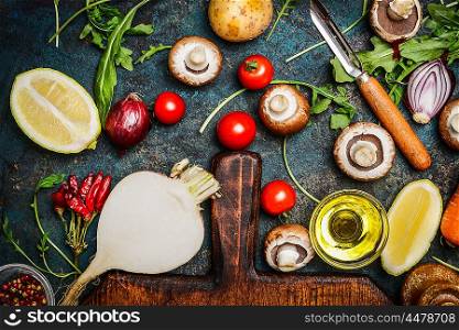 Vegetables and ingredients for health cooking on rustic background, top view. Vegetarian and diet concept.