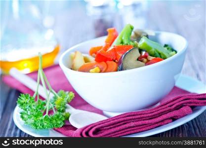 vegetables in bowl and on a table