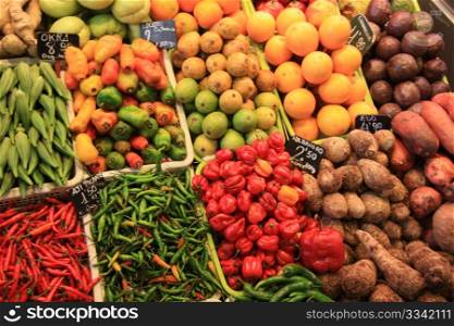 Vegetables like peppers and okra, displayed on a spanish market