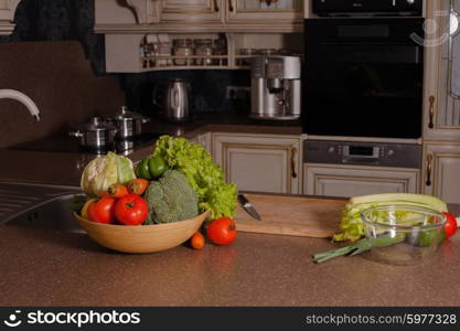 Vegetables near the casseroles in the kitchen, cooking concept