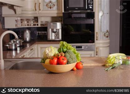 Vegetables near the casseroles in the kitchen, cooking concept. Vegetables in the kitchen