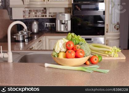 Vegetables near the casseroles in the kitchen, cooking concept. Vegetables in the kitchen