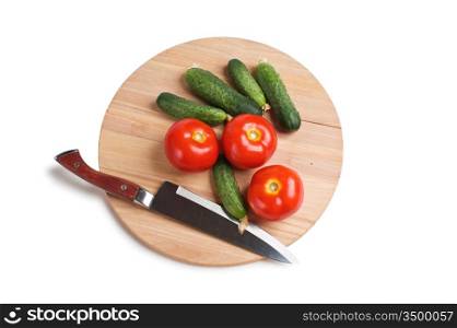 vegetables on a cutting board isolated on white