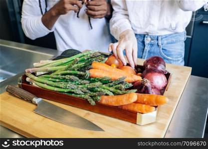 vegetables on a wooden tray in the kitchen