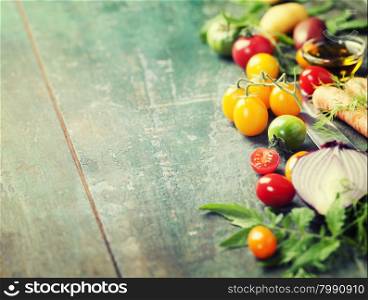 Vegetables on wood. Bio Healthy food, herbs and spices. Organic vegetables on wood. Cooking, Healthy Eating or Vegetarian concept. Background layout with free text space.