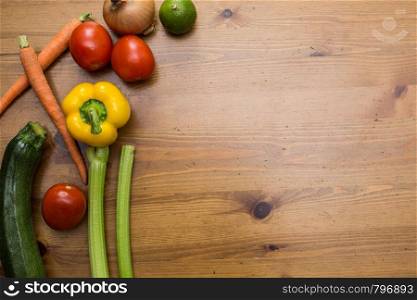 Vegetables on wood. Bio Healthy food, herbs and spices. Organic vegetables on wood close-up. Vegetables on wood. Bio Healthy food, herbs and spices. Organic vegetables on wood