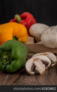 Vegetables on wooden box on wooden table background
