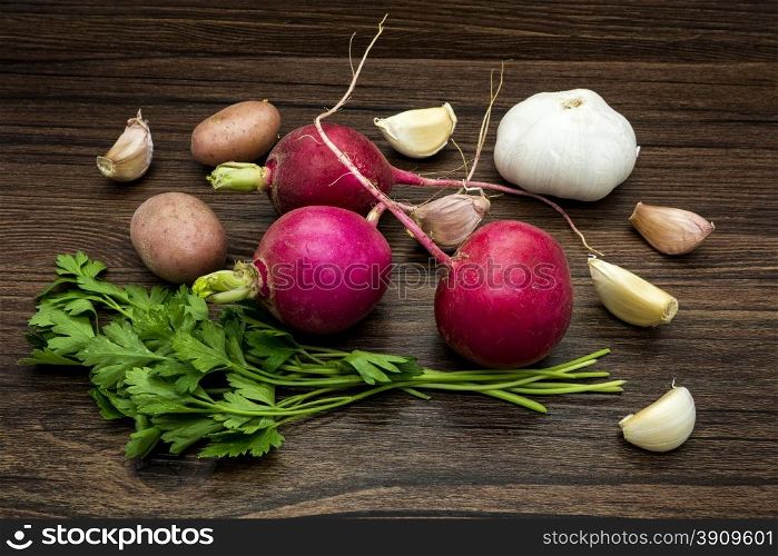Vegetables still life on a wooden table brown color.