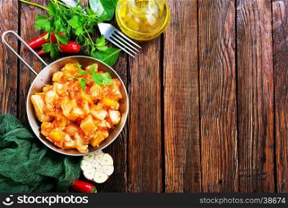 vegetables with sauce in pan and on a table