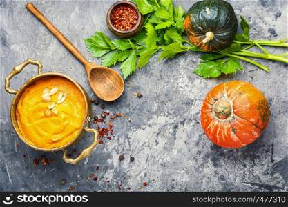 Vegetarian autumn pumpkin cream soup.Seasonal autumn food. Pumpkin vegan soup