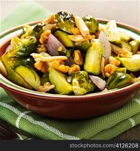 Vegetarian bowl of roasted brussels sprouts with walnuts