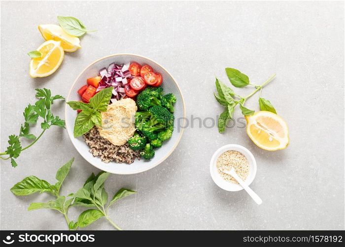 Vegetarian Buddha bowl with quinoa, vegetables and hummus, healthy food concept