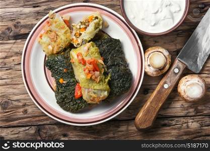 Vegetarian cabbage rolls on plate. Diet food.Vegetable dietary cabbage rolls in leaf of savoy cabbage