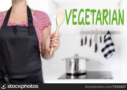 vegetarian chef holding wooden spoon background.. vegetarian chef holding wooden spoon background