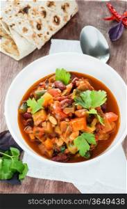 Vegetarian chilli with red and white beans, vertical