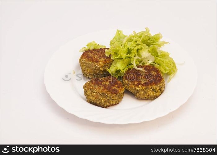 vegetarian cutlets with fresh salad on white plate