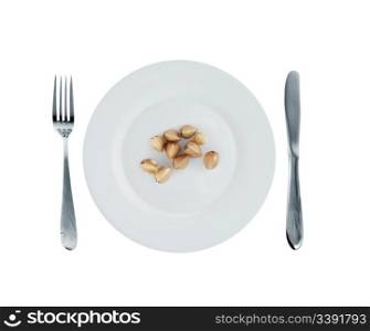 Vegetarian dish - buckwheat. A crude product of the big size on an empty plate