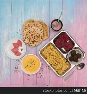 Vegetarian food set. Vegetarian food: pea soup, pilaf, flat cakes, beet cutlets, pumpkin seeds and compote of pickled pears