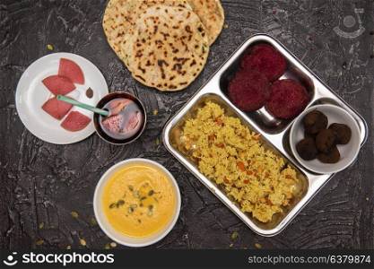 Vegetarian food set. Vegetarian food: pea soup, pilaf, flat cakes, beet cutlets, pumpkin seeds and compote of pickled pears