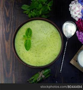 Vegetarian fresh pea cream soup, still life