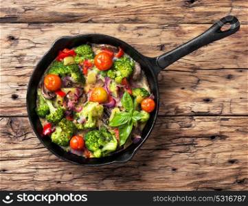 Vegetarian Italian Omelette. Vegetarian Italian omelet on rustic wooden background