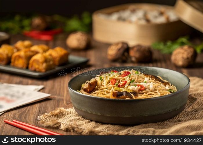 Vegetarian Noodles or Homemade Noodles. Traditional Asian instant noodles meal with mushrooms and vegetables stir fired dish. Asian food. Top view