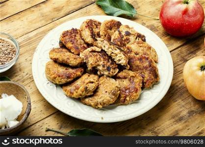 Vegetarian oatmeal and apple cutlets on a plate. Healthy nutrition. Homemade cutlets from oatmeal and apples.