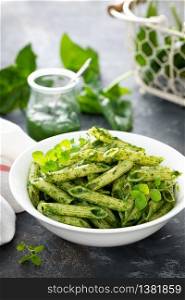 Vegetarian pasta penne with savory spinach sauce