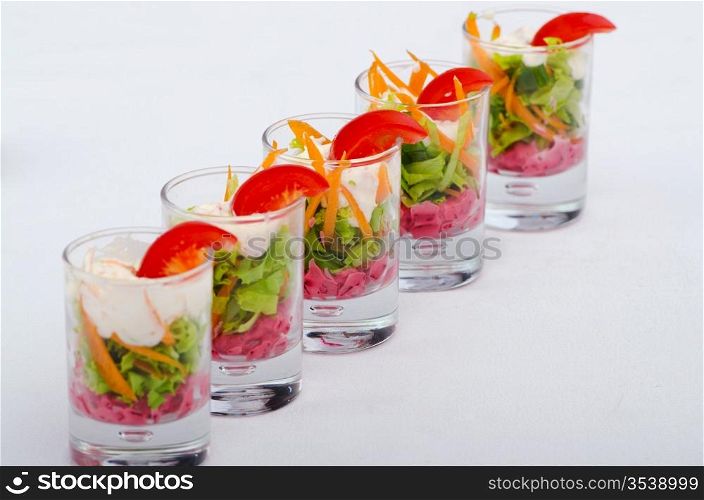 Vegetarian salad served in glasses