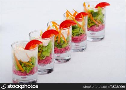 Vegetarian salad served in glasses
