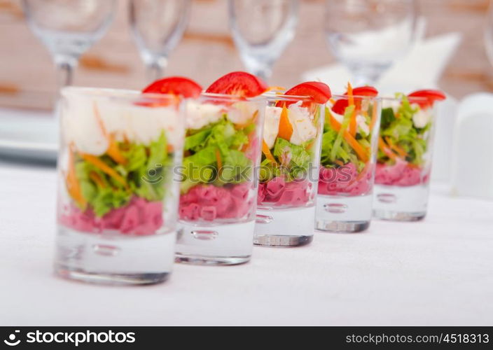 Vegetarian salad served in glasses