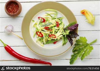Vegetarian salad with fresh zucchini, peppers and garlic.. Zucchini vegetable salad