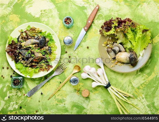 Vegetarian salad with mushrooms. Autumn salad with wild mushrooms and lettuce