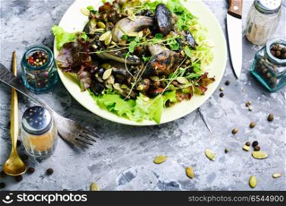 Vegetarian salad with mushrooms. Autumn salad with wild mushrooms and lettuce.Vegetarian food
