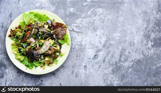 Vegetarian salad with mushrooms. Autumn salad with wild mushrooms and lettuce.Vegetarian food