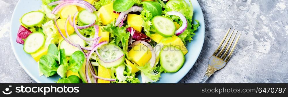 Vegetarian salad with vegetable and mango. Vegan salad of vegetables, herbs and mango.Vegan salad.Diet menu.Lettuce