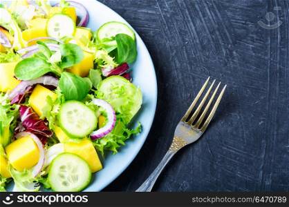 Vegetarian salad with vegetable and mango. Vegan salad of vegetables, herbs and mango.Vegan salad.Diet menu.Lettuce