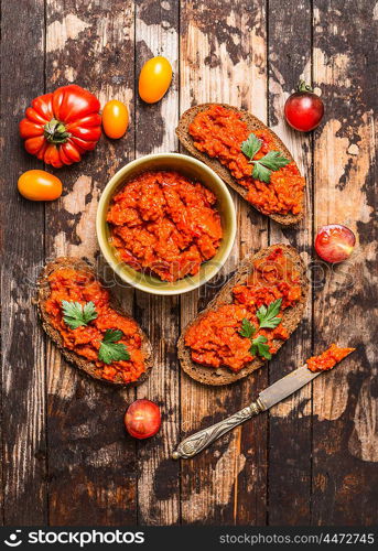 Vegetarian snack with tomatoes spread on bread , top view. Healthy food concept.