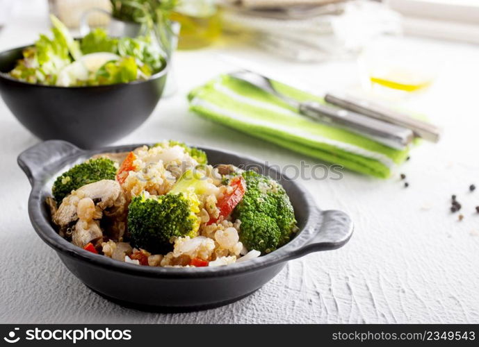 vegetarian stir fry in black pan, vegan food