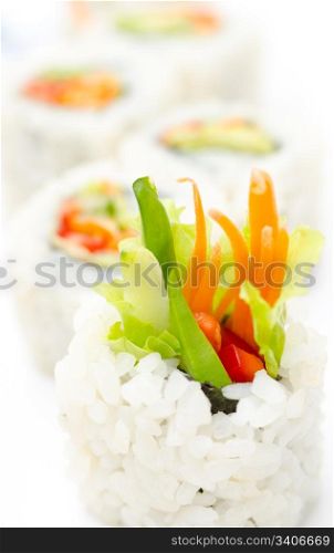 vegetarian sushi rolls with avocado and vegetables, macro