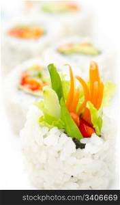 vegetarian sushi rolls with avocado and vegetables, macro