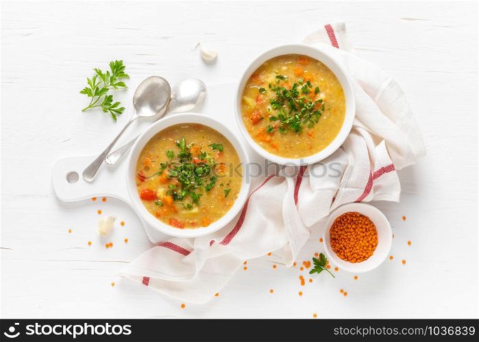 Vegetarian vegetable lentil soup with fresh parsley, healthy eating, top view